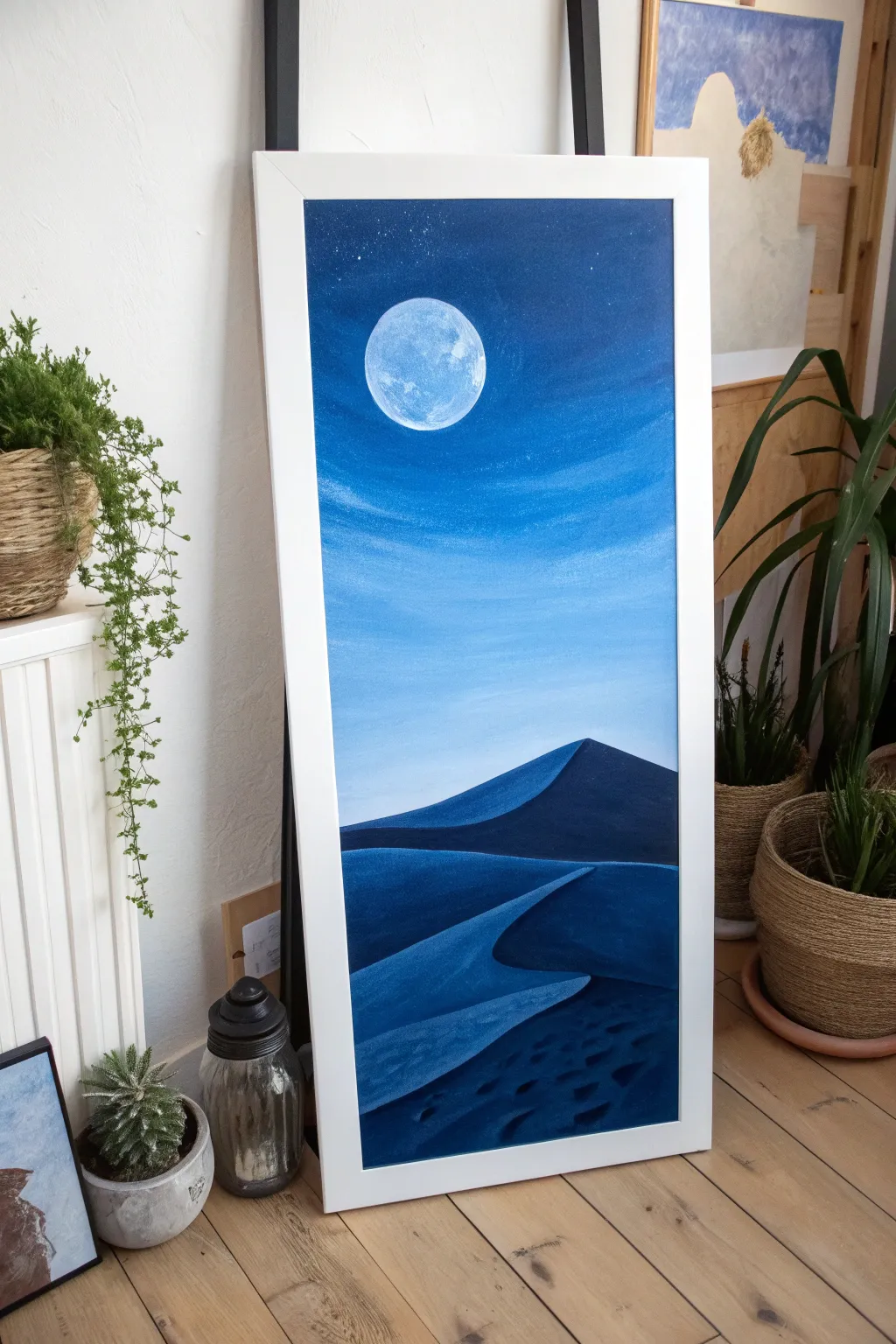 Minimal blue desert night acrylic: dark dunes and an oversized glowing moon for calm boho vibes