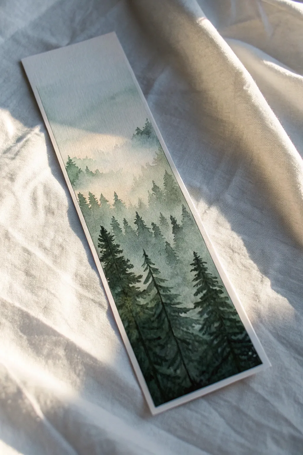 Get lost in the woods with this serene misty forest bookmark idea. 🌲✨