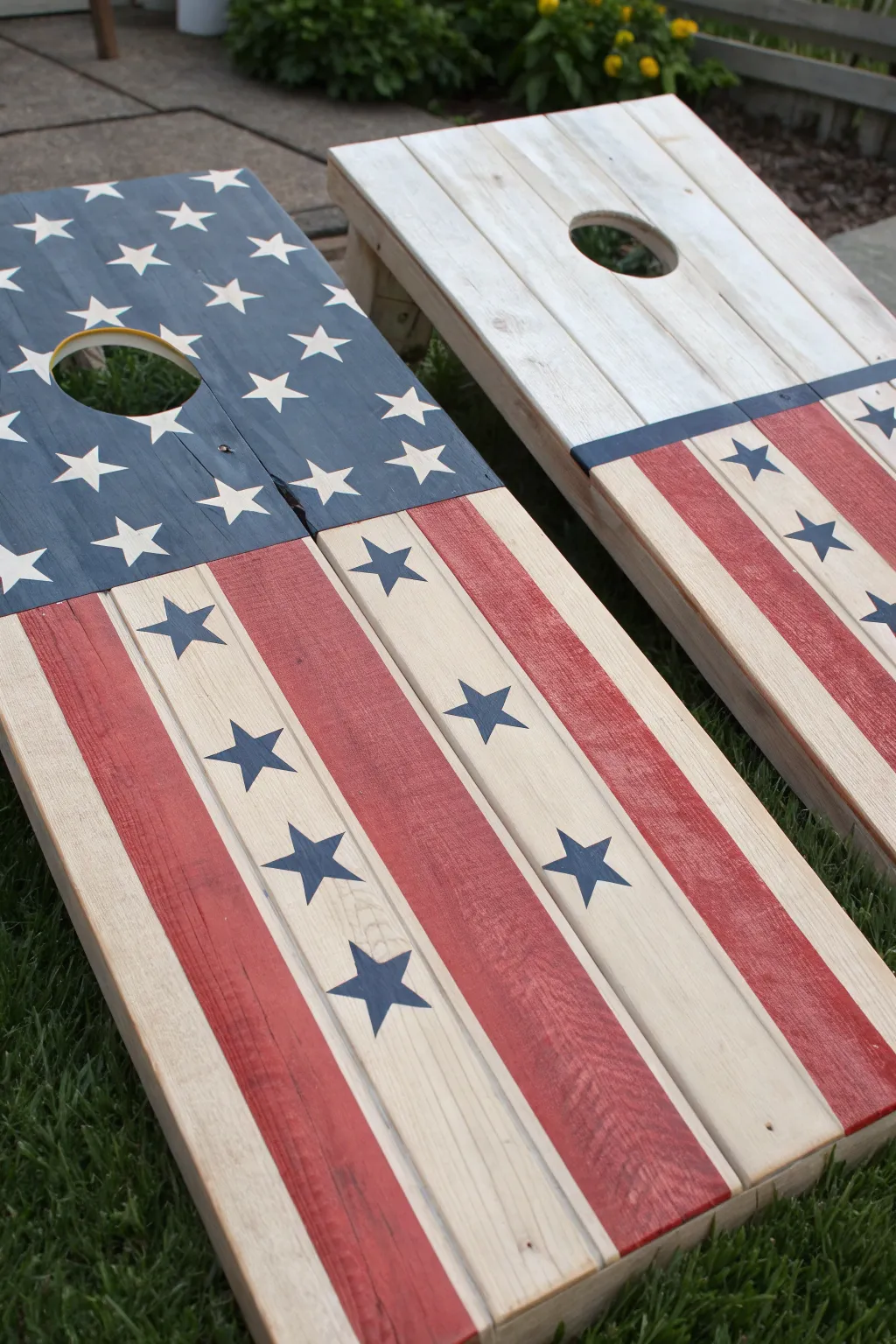 Minimal stars-and-stripes cornhole set with stripes leading to the hole, patio-ready charm