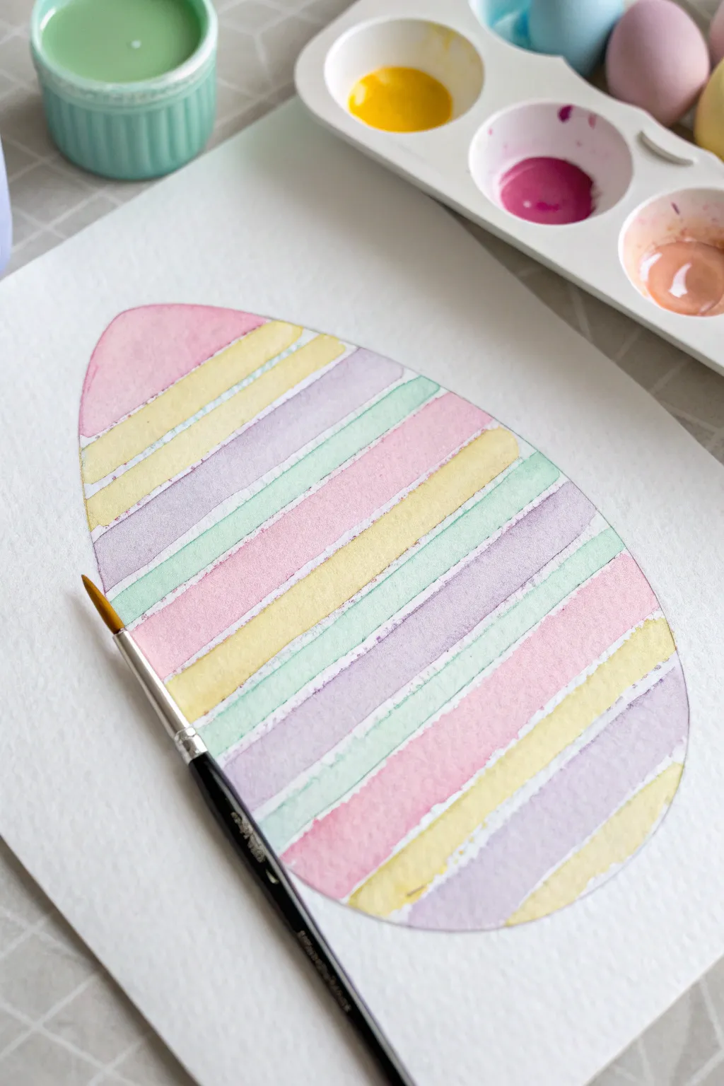 Pastel fork-textured egg stripes, a quick kid-friendly Easter painting in minimalist style.