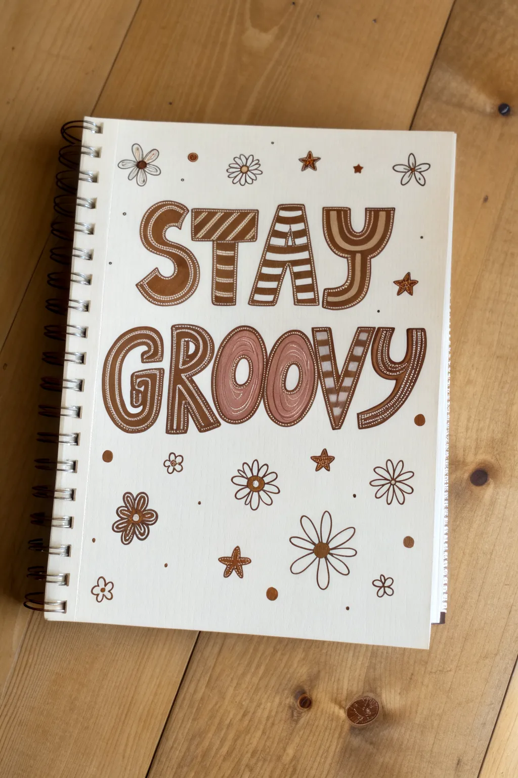 Groovy bubble-letter quote in bright stripes on a clean sketchbook page with tiny stars and blooms.