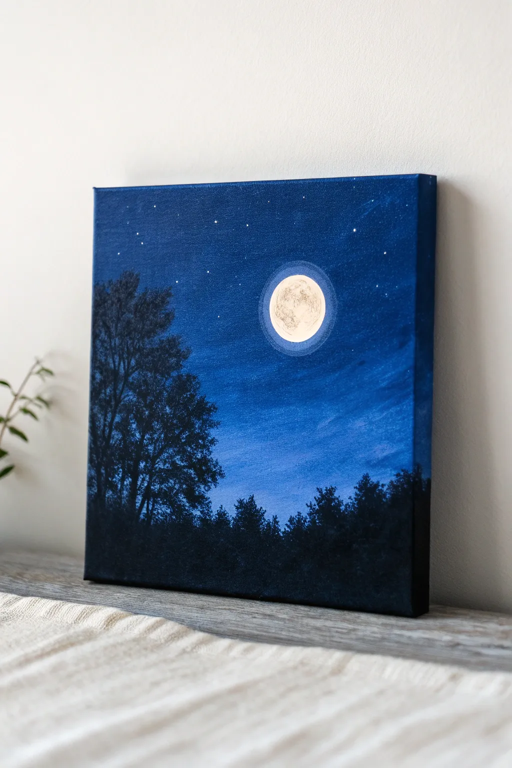 Simple moonlit night oil painting: deep blues, glowing moon halo, and a calm dark treeline.