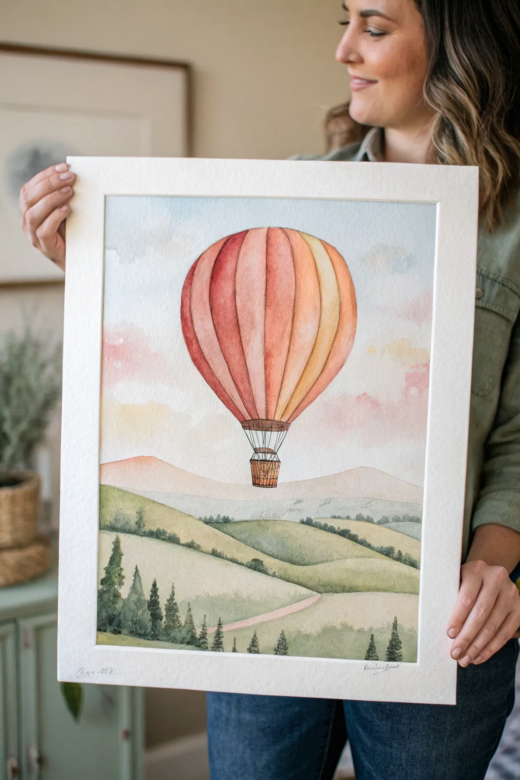 Simple watercolor hot air balloon over soft green hills, perfect easy painting idea to copy