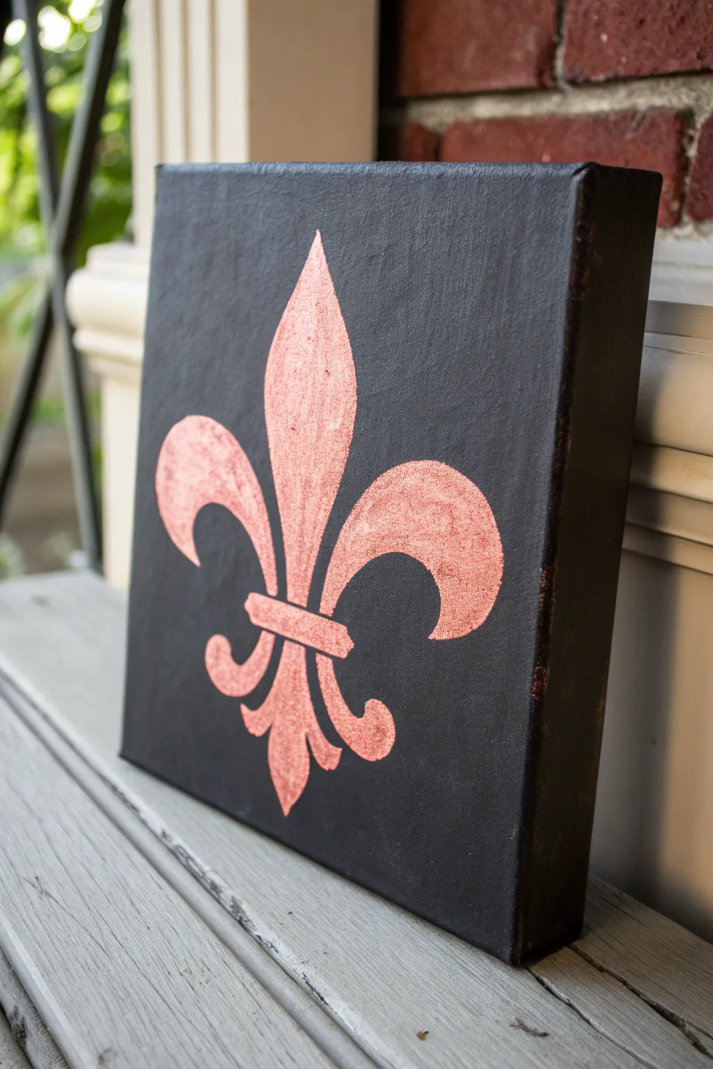 Bold fleur de lis silhouette on deep ink-black, minimalist contrast for chic painting inspo.