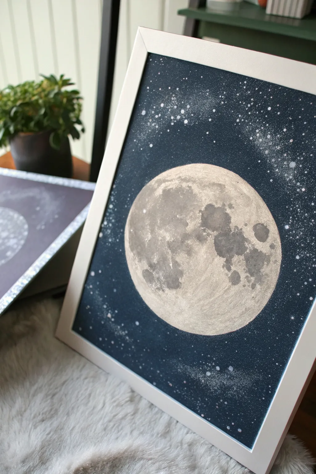 Pale moon with silver glitter rim and a soft halo against a deep velvety night sky