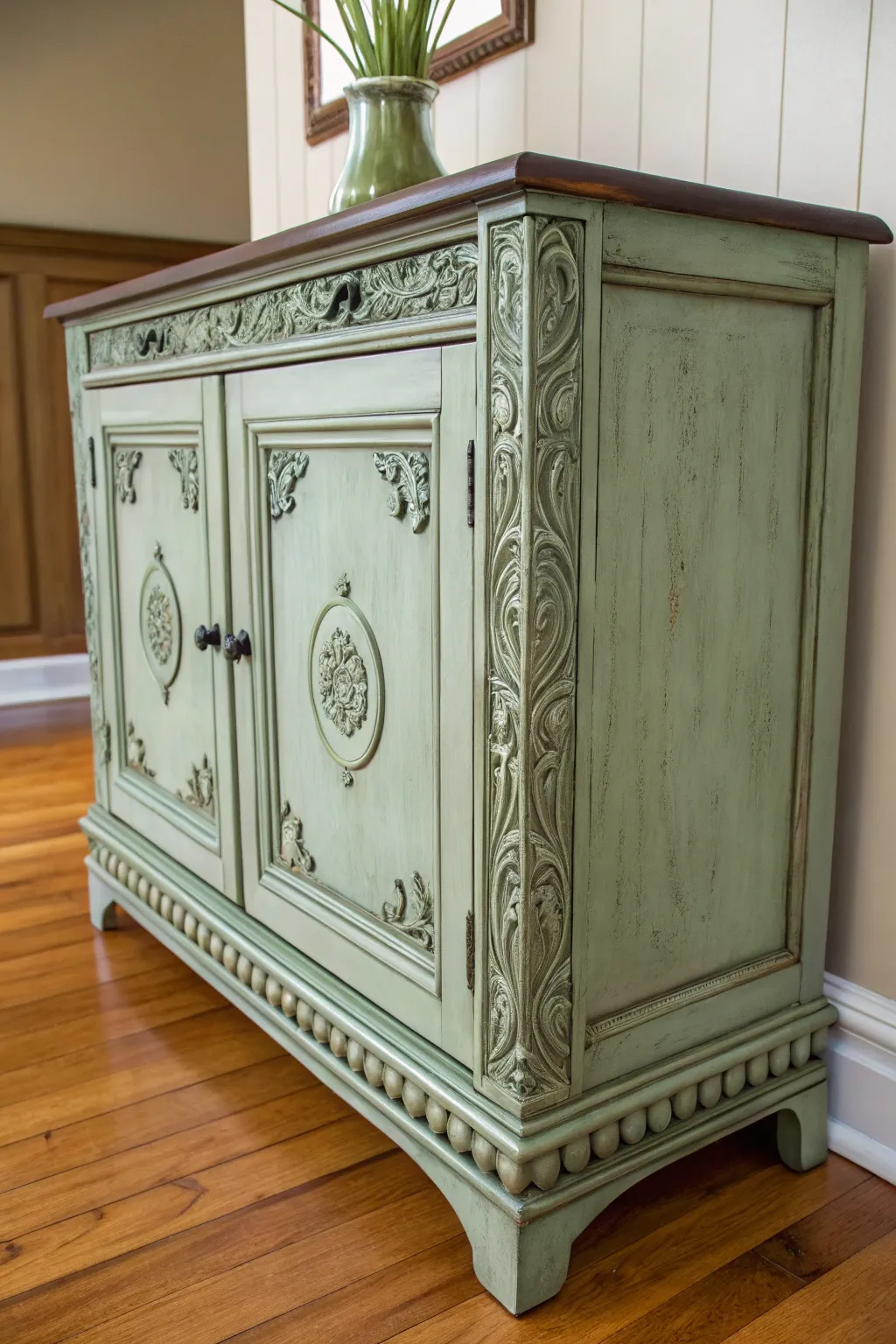 Antiqued green buffet detail with dark glaze for rich depth and heirloom charm.