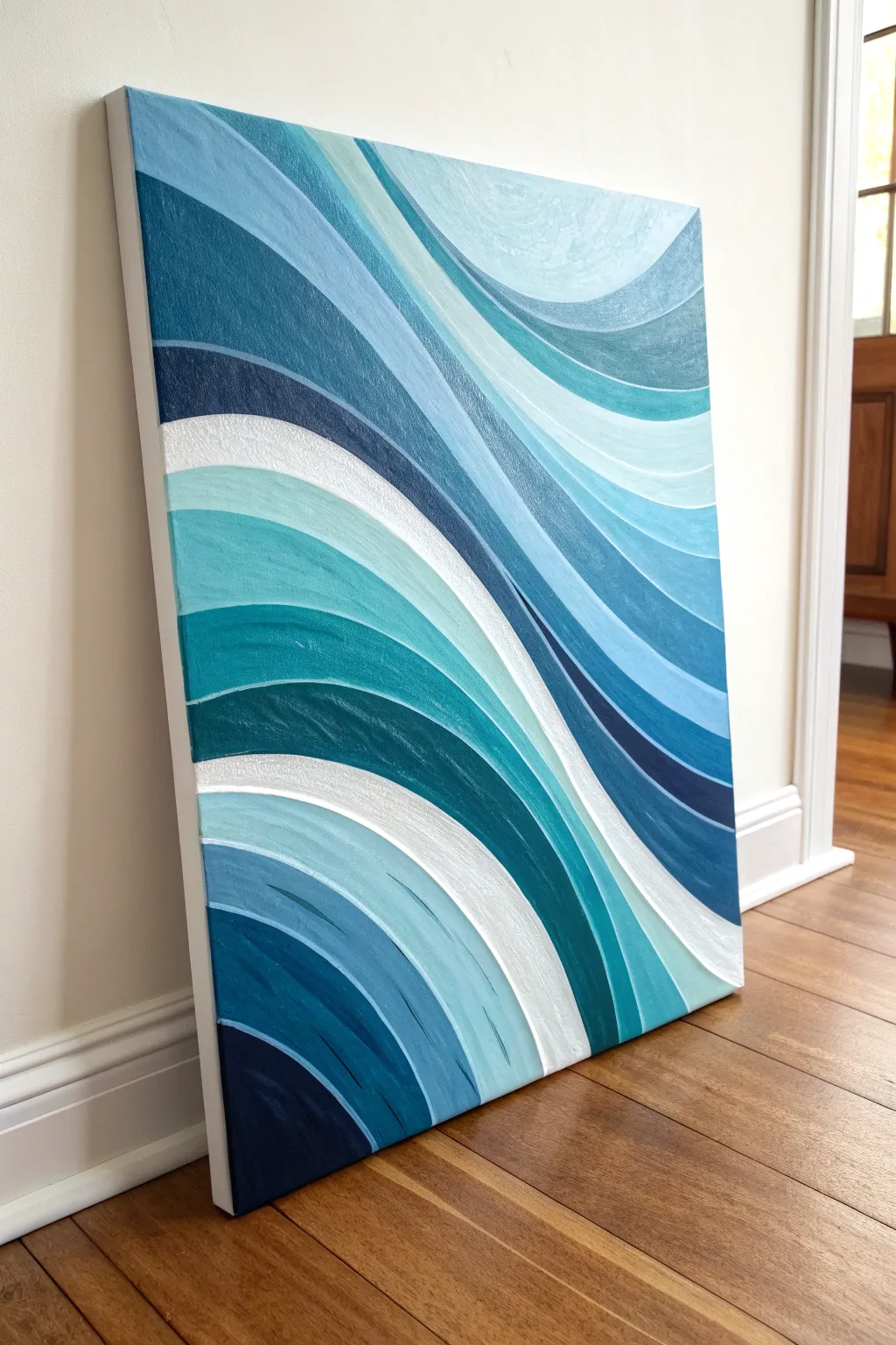 Abstract layered blue waves on a medium canvas, minimalist coastal calm with hand-brushed texture.