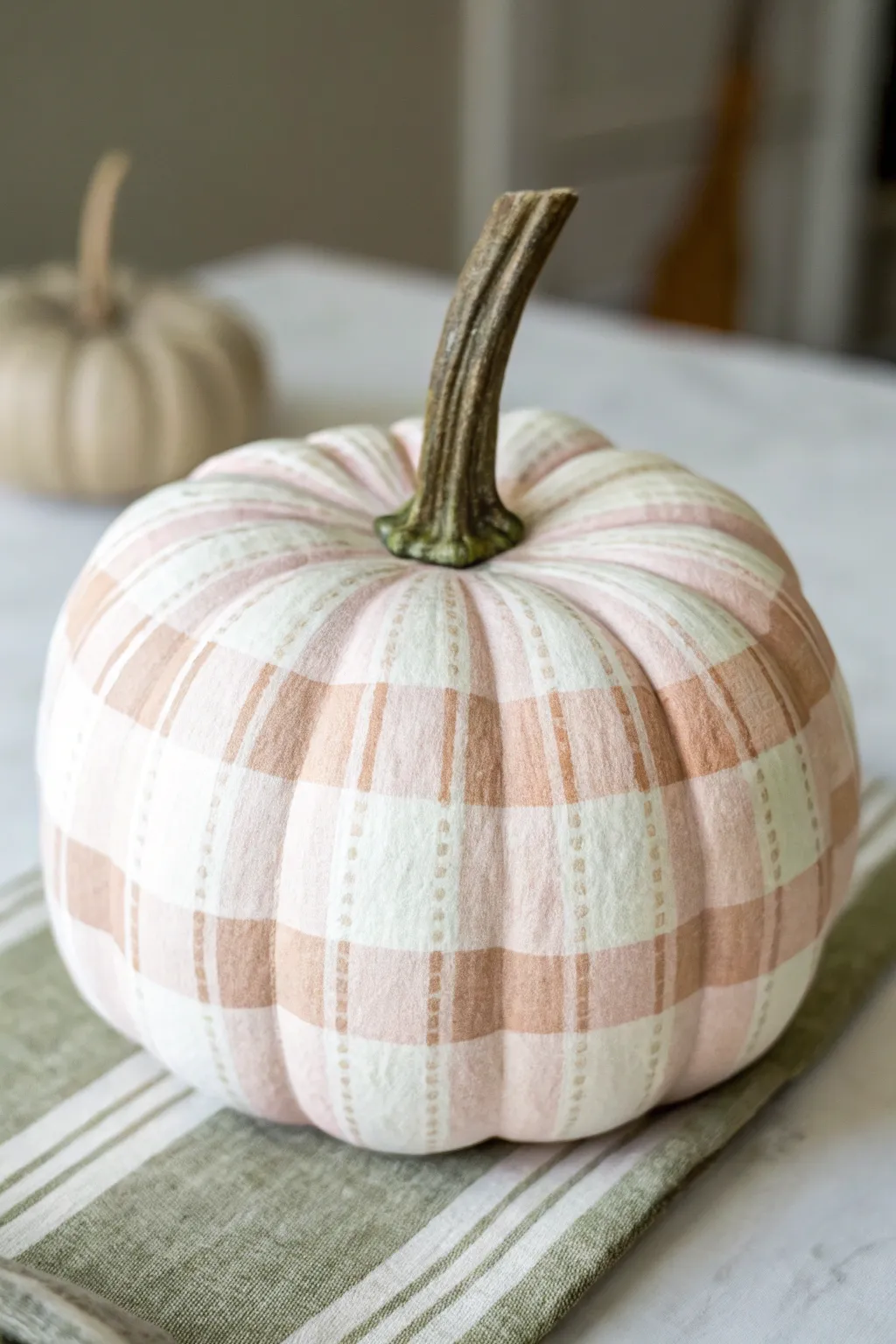 Soft gingham plaid mini pumpkin in warm light, simple, cozy, and perfectly handmade