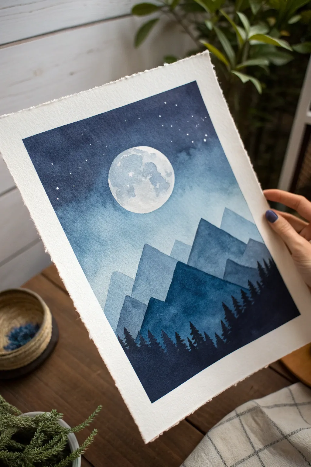 Luminous full moon over misty layered mountain silhouettes, minimalist watercolor depth study.