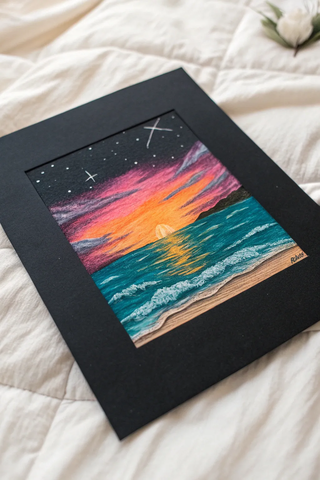Oil pastel landscape on black paper lets sunset colors blaze with crisp white highlights