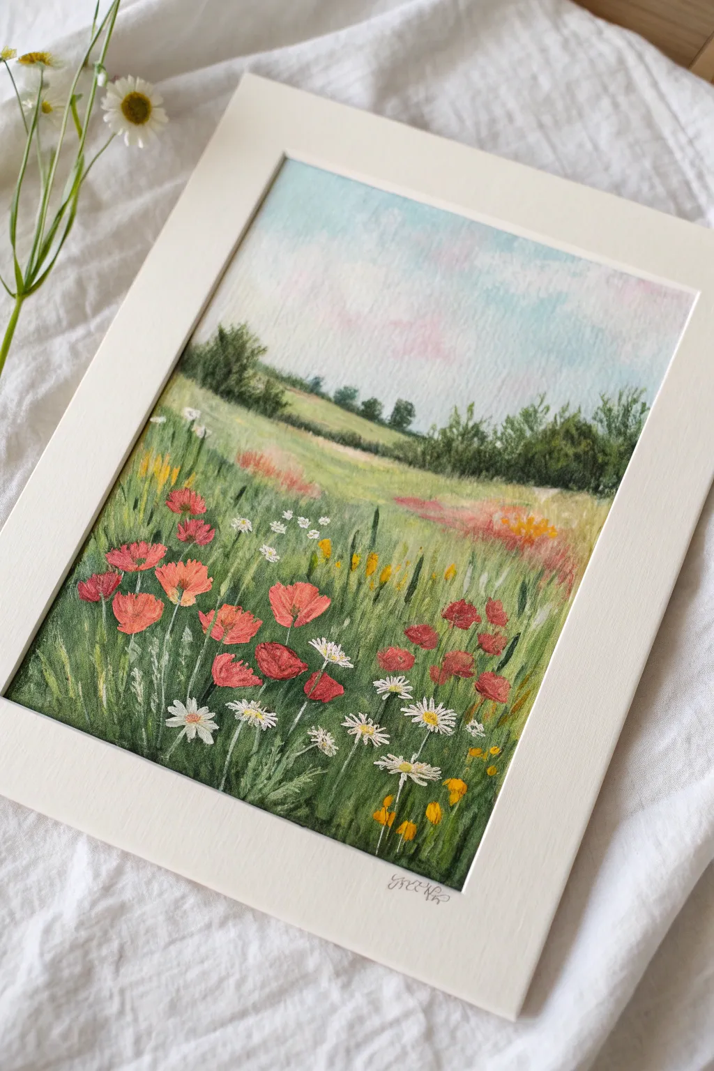 Loose dabbing oil pastels form a bright wildflower field with bold contrast and lively texture
