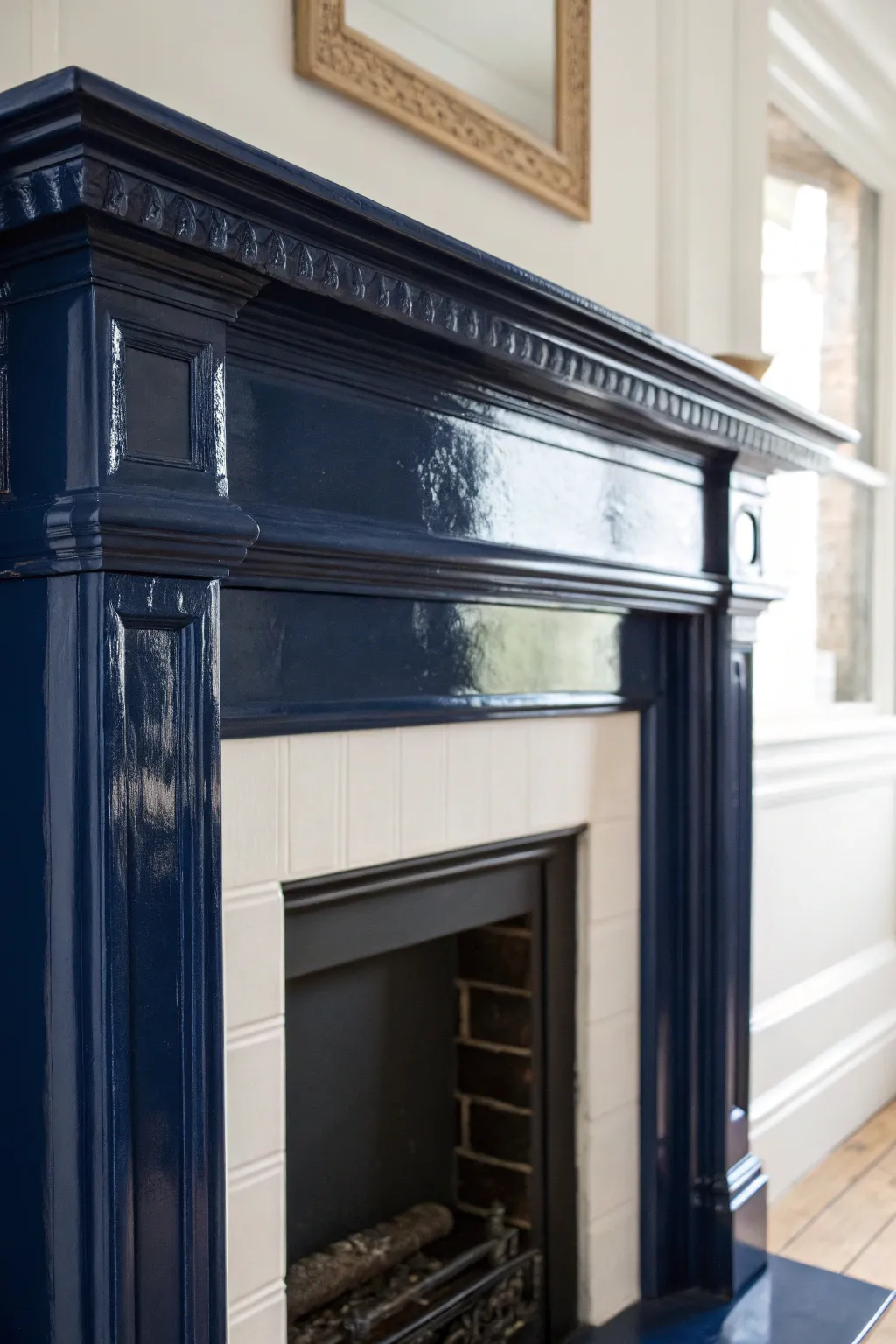 Dark high-gloss mantel with soft window reflections, highlighting crisp edges and molding.