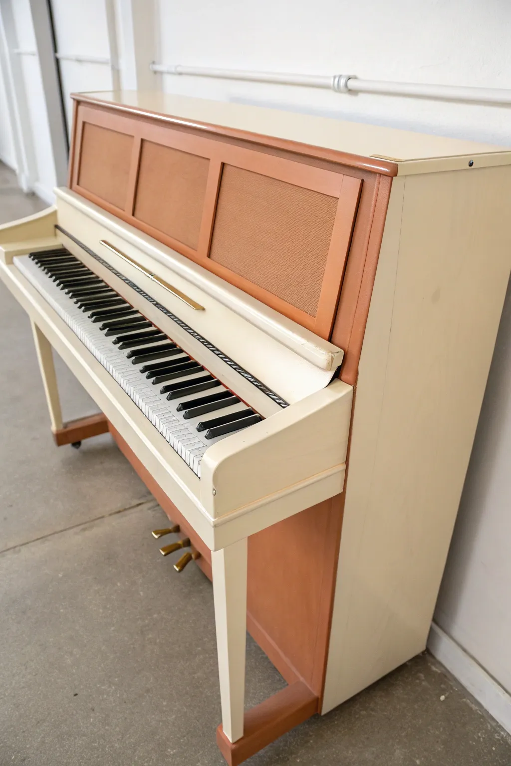 Two-tone paint makes a minimalist upright piano feel modern, warm, and effortlessly chic.