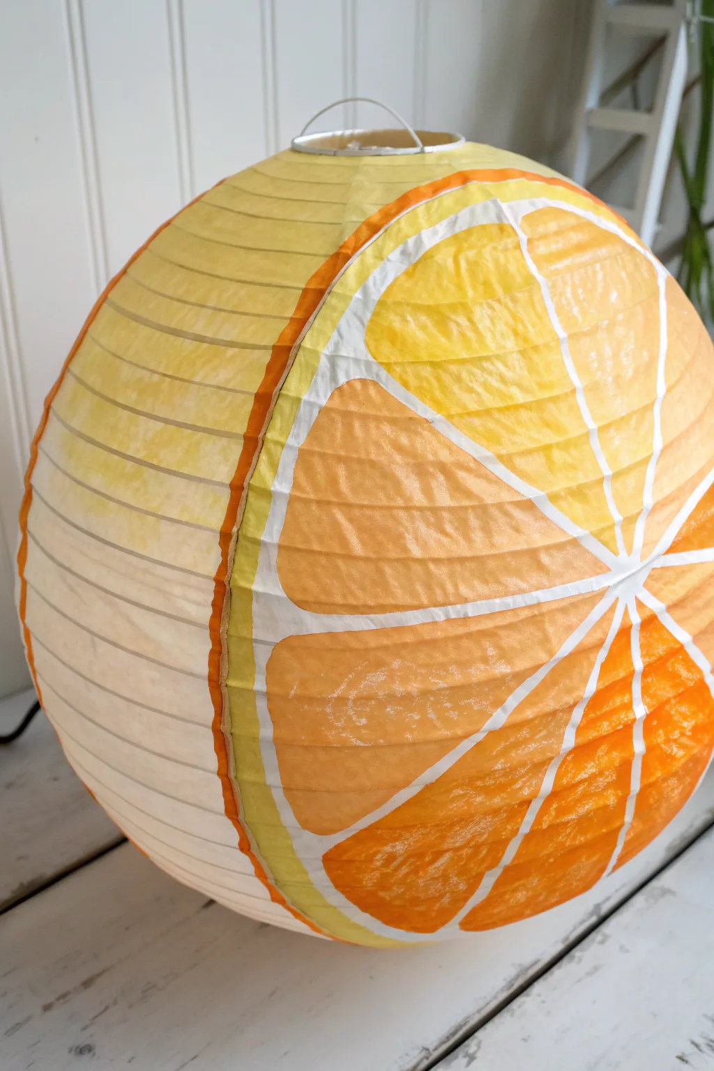 Cute citrus-slice paper lantern with soft gradients and crisp wedge lines on a clean backdrop