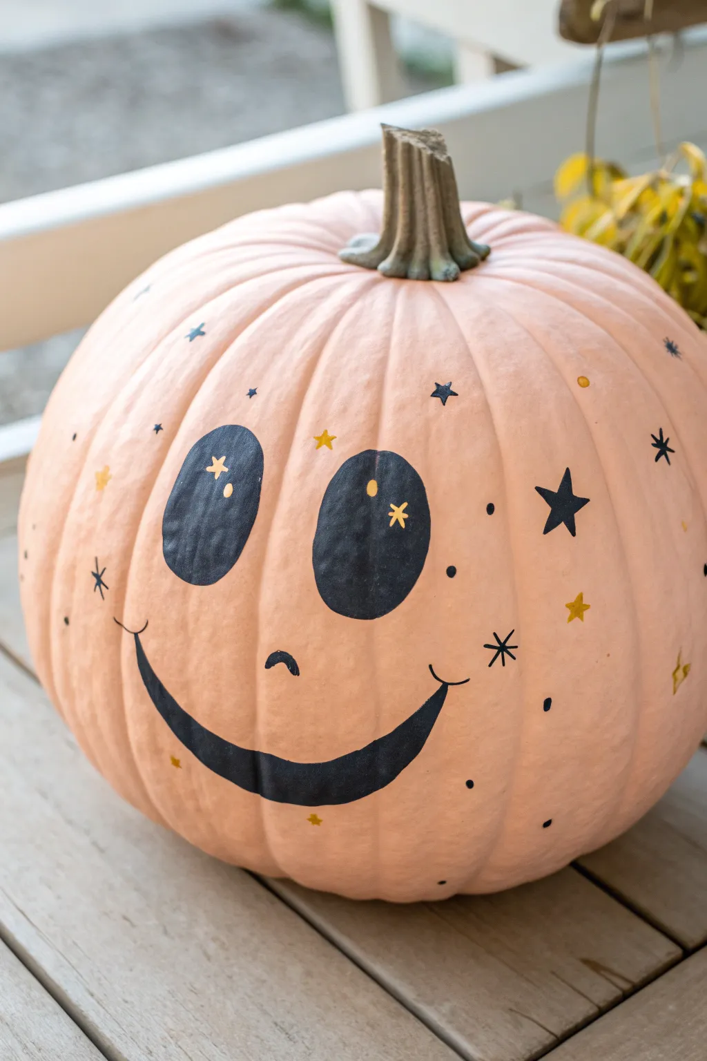 Pastel preppy pumpkin with bold smiley face, minimalist boho styling, bright happy contrast