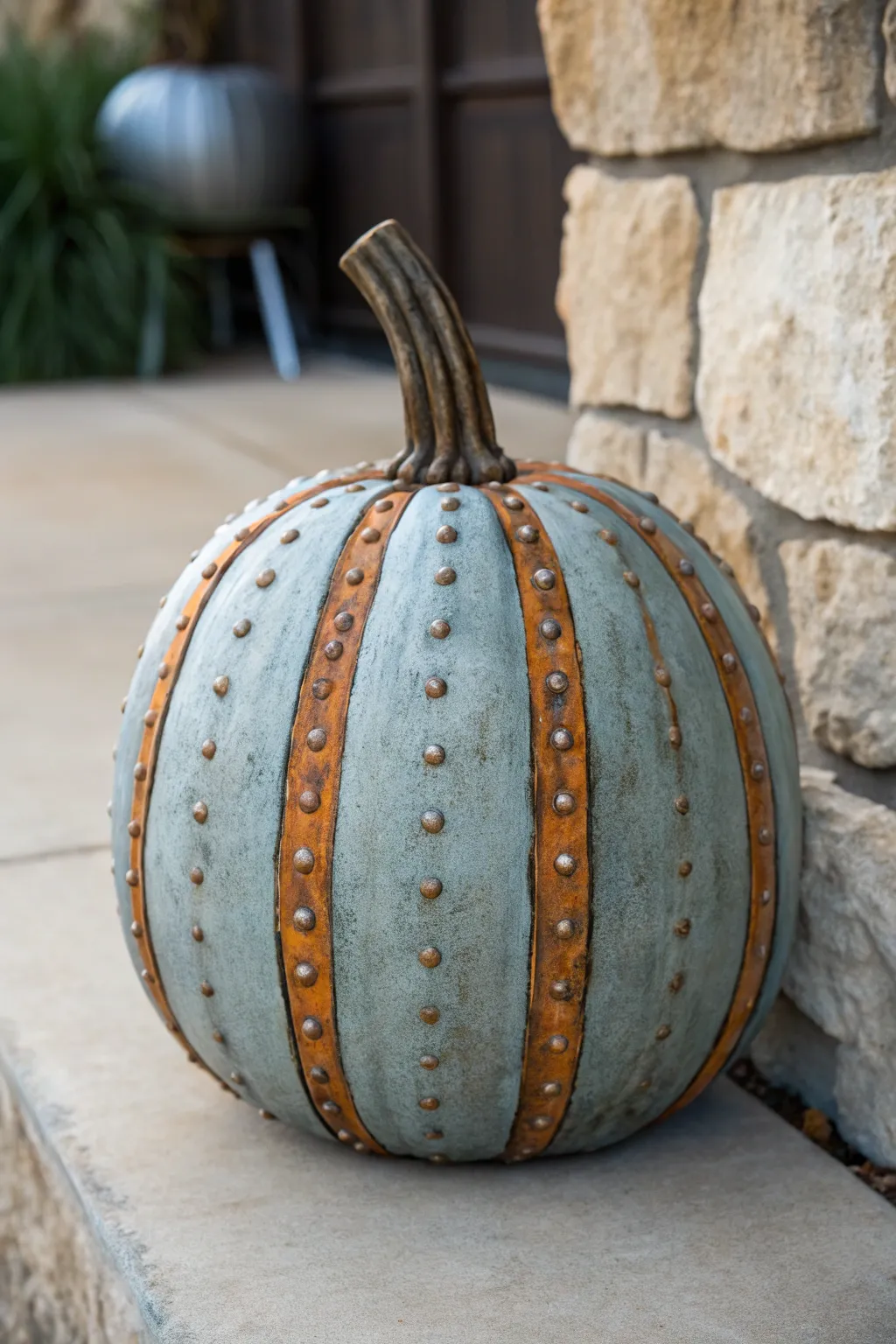 DIY weathered metal pumpkin: rivet details and rust streaks with minimalist industrial charm