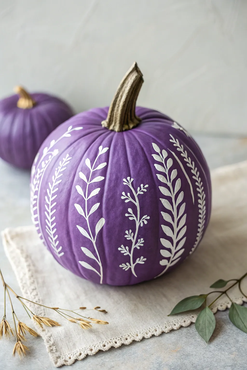 Elegant purple pumpkin with delicate white vines and leaves in a clean minimalist style
