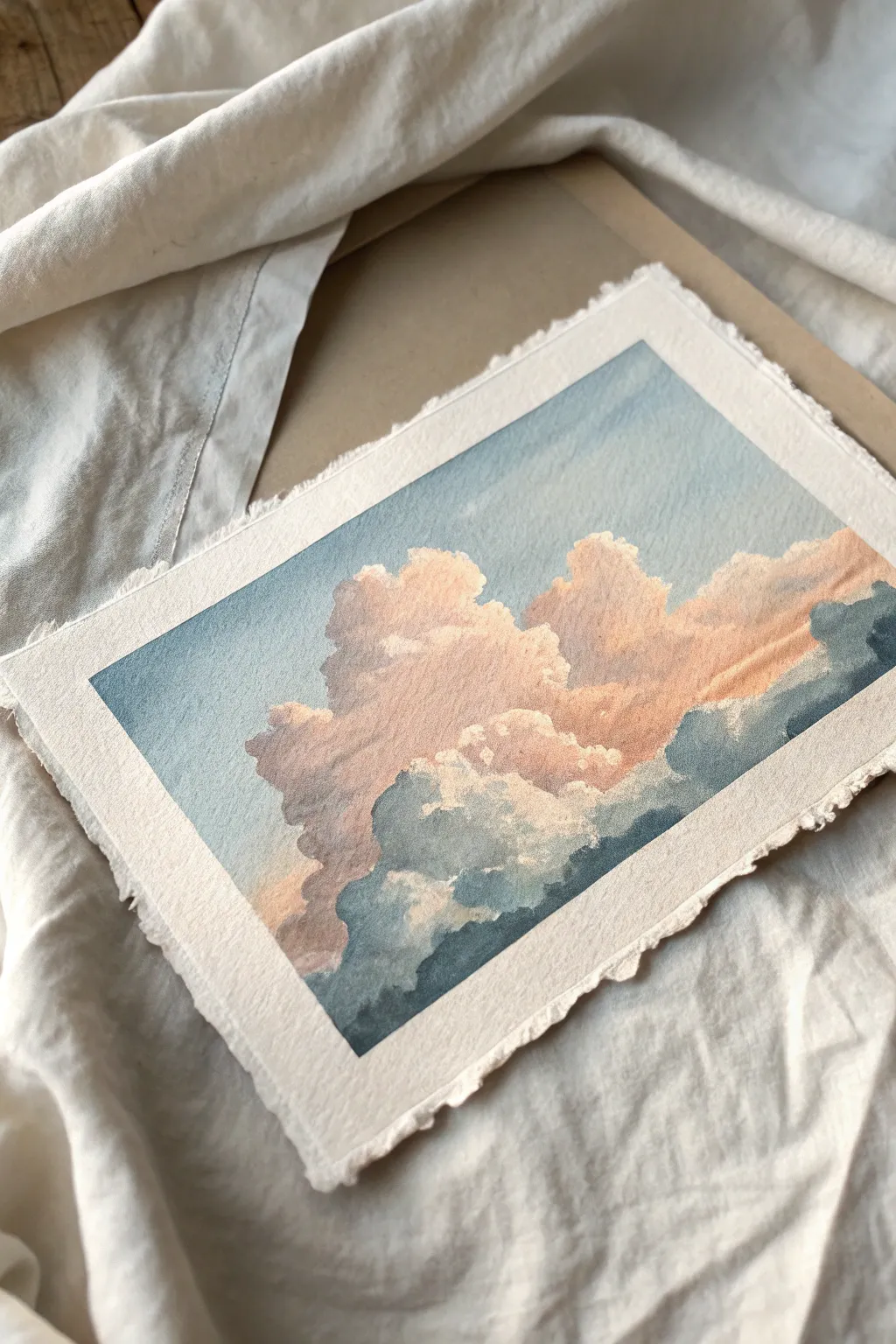Try a sponge-dab cloud study: soft gradient sky, fluffy textures, calm minimalist vibes