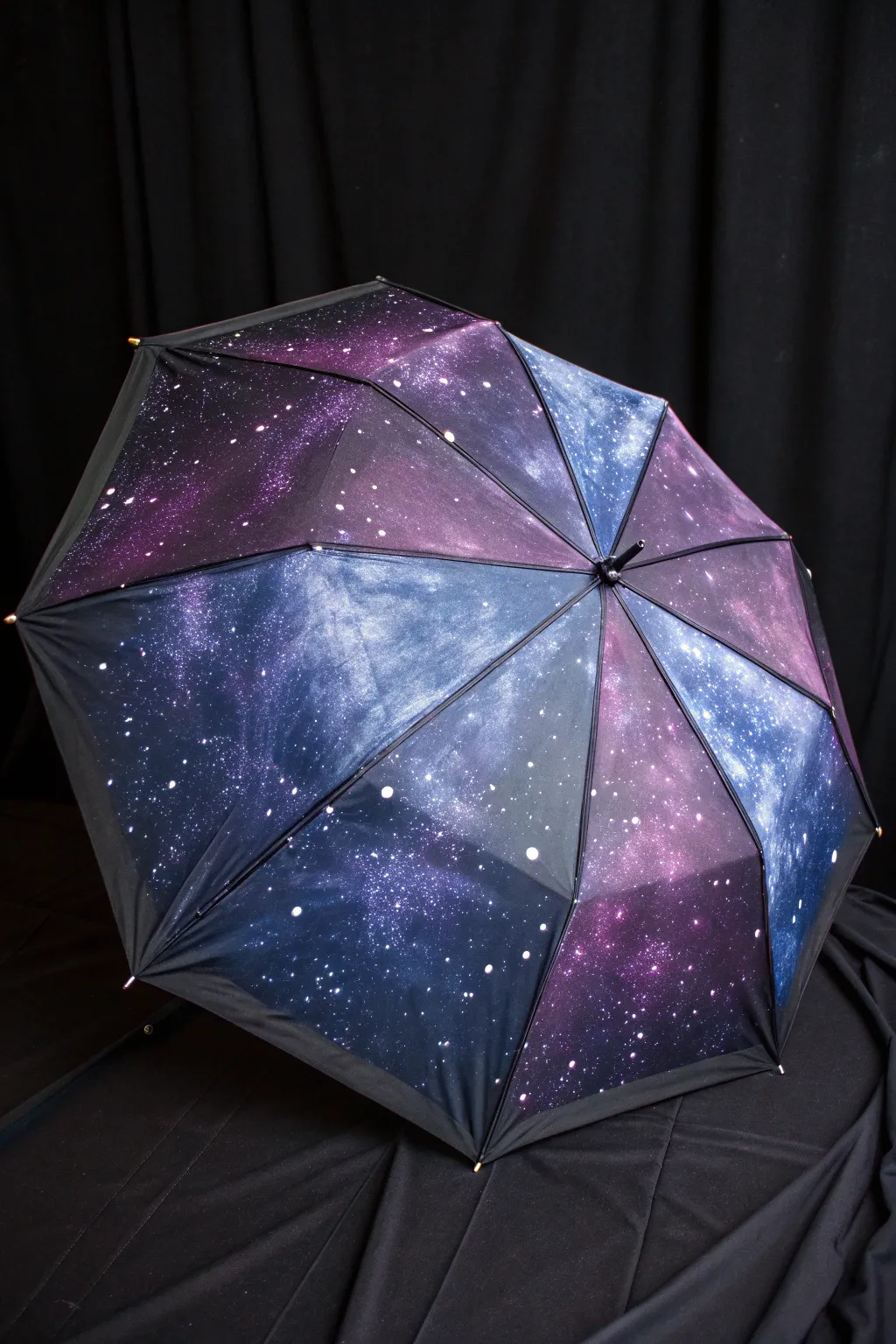 Galaxy-painted umbrella on black backdrop, minimalist yet dreamy nebula and starry craftsmanship