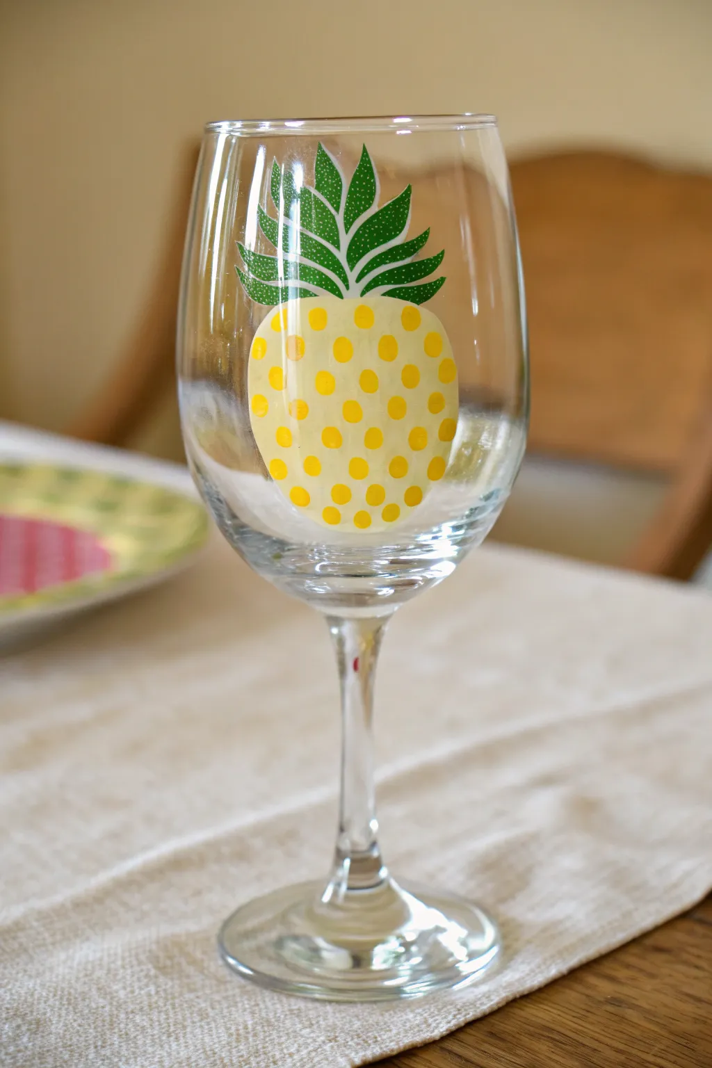 Beginner-friendly dotted pineapple wine glass painting, bright and minimal with boho charm.
