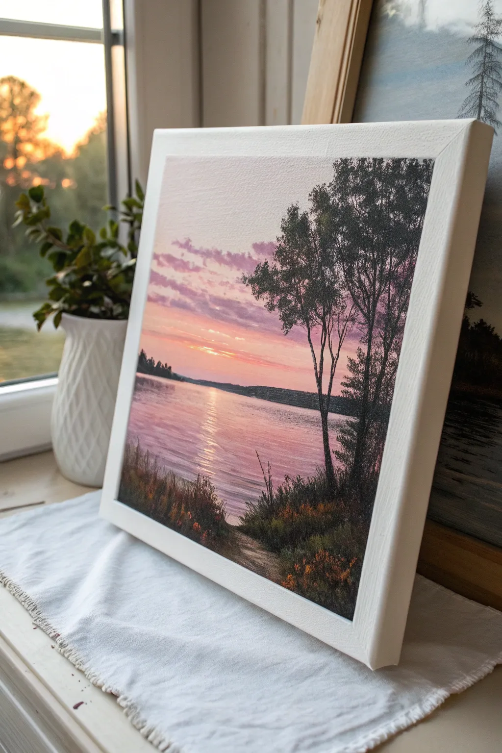 Bold mermaid silhouette with two dolphins leaping over a glowing sunset sea, minimal and dreamy.