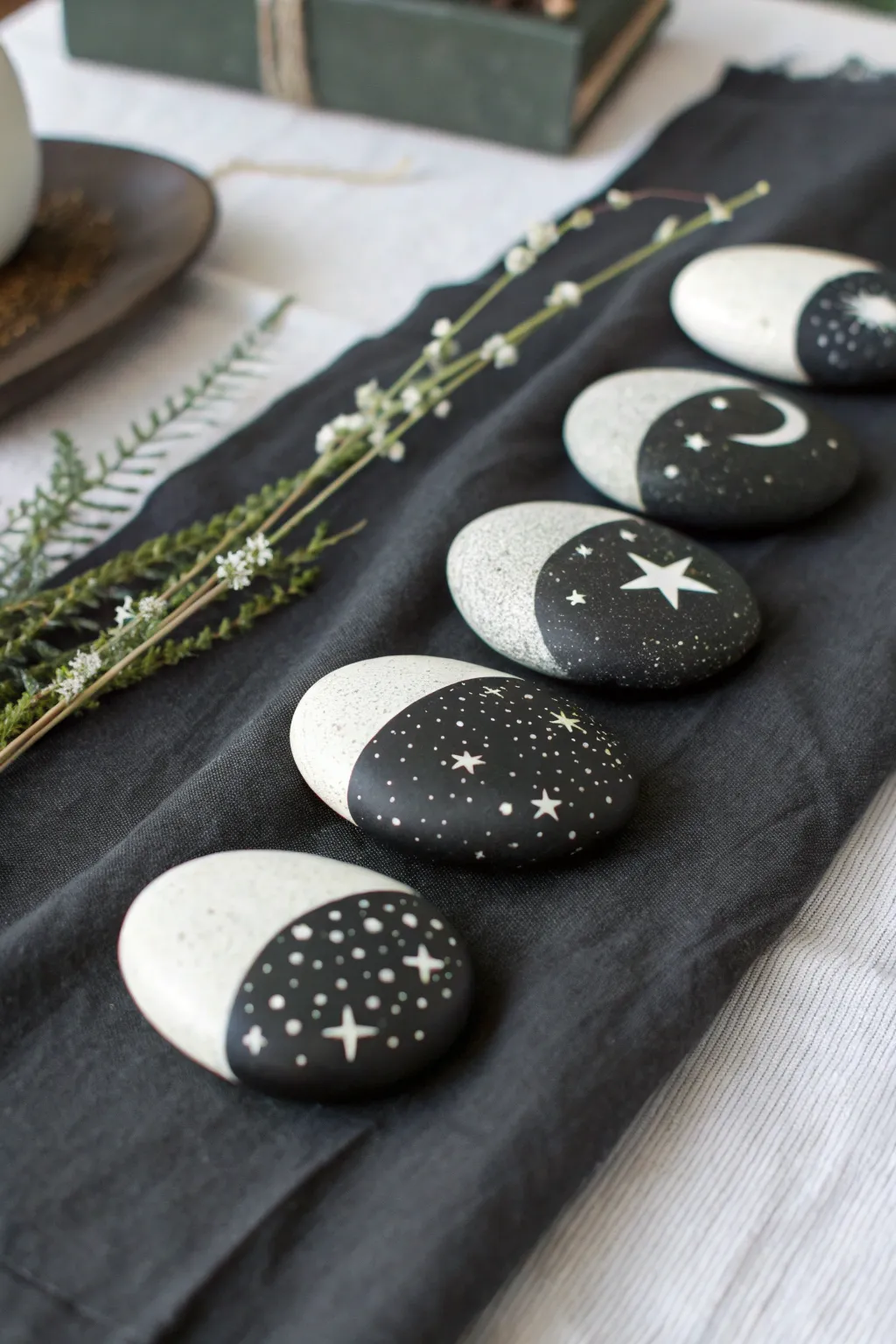 Minimal moon phase rock set with tiny star map details, clean contrast and dreamy boho mood.
