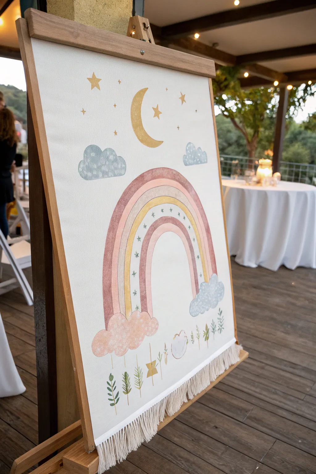 Soft pastel rainbow canvas with airy clouds and space for guest signatures at the baby shower.