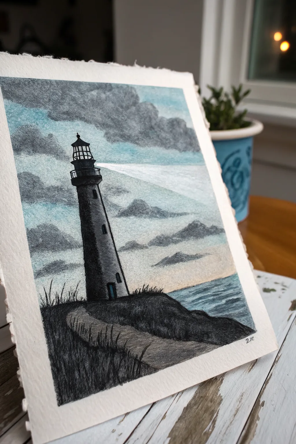 Easy oil pastel lighthouse silhouette set against a blended stormy sky with a simple light beam