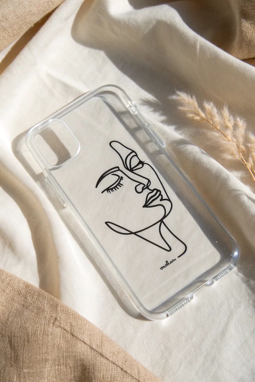 Single-line face in black on a clear case, balanced with a tiny white accent and airy space