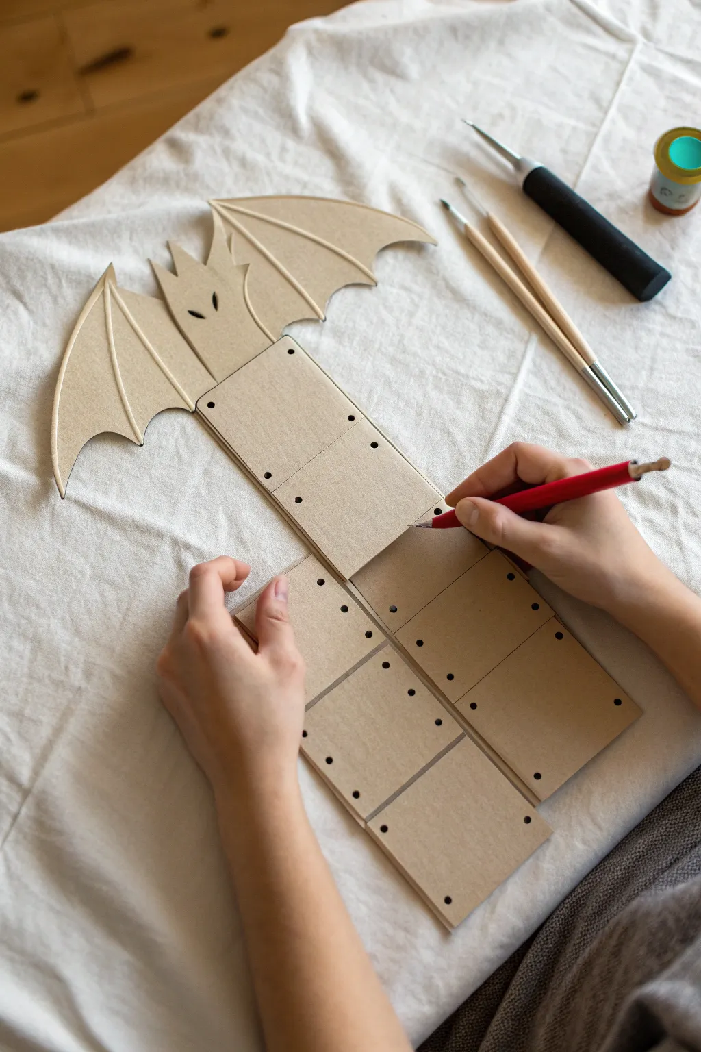 Crisp fold-and-tab paperboard dragon base, airy and minimal for easy puppet building.