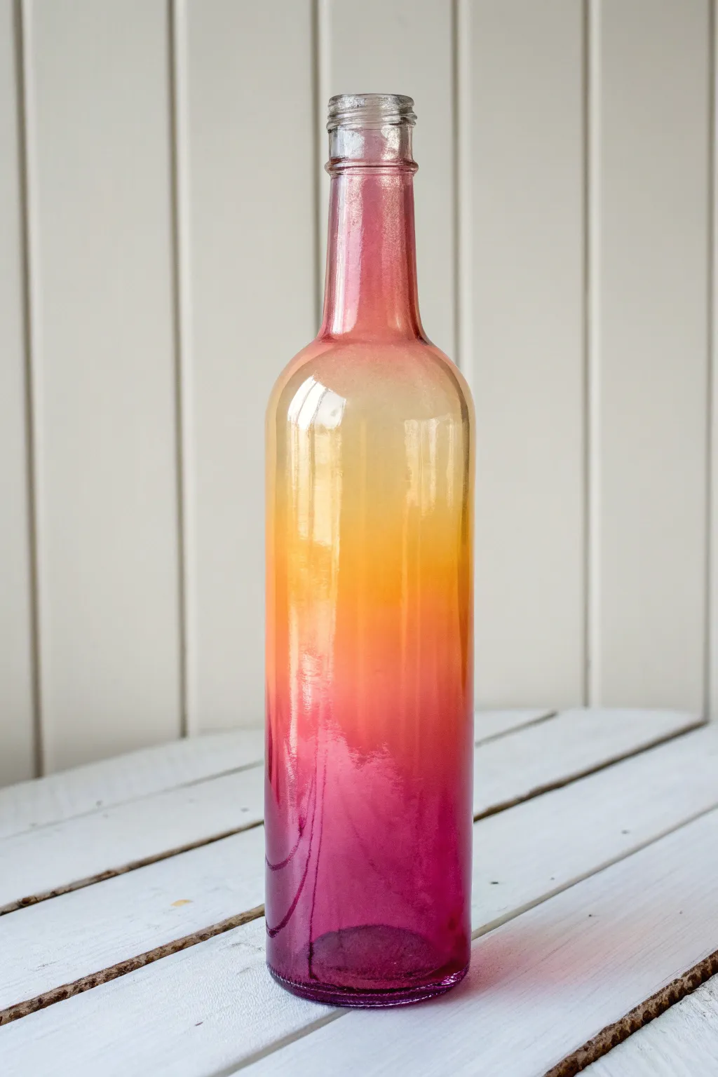 Sunset ombre bottle in soft Scandinavian light, blended in three simple sponge strokes