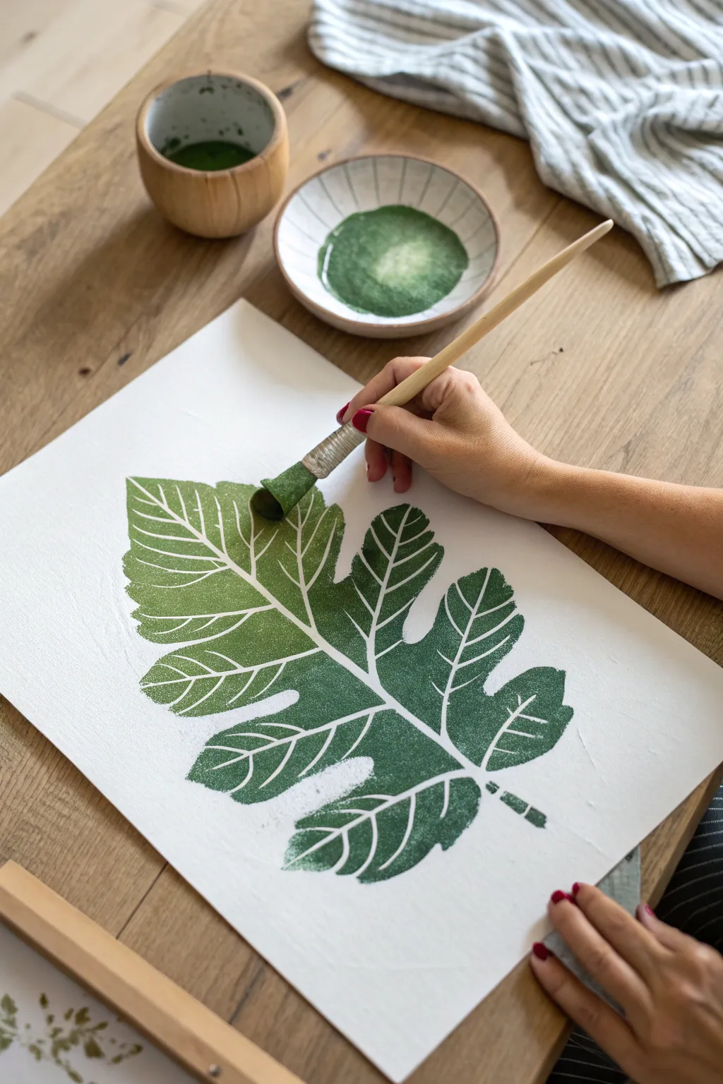 Simple stencil dabbing creates a bold leaf shape, perfect for calm, guided painting sessions.