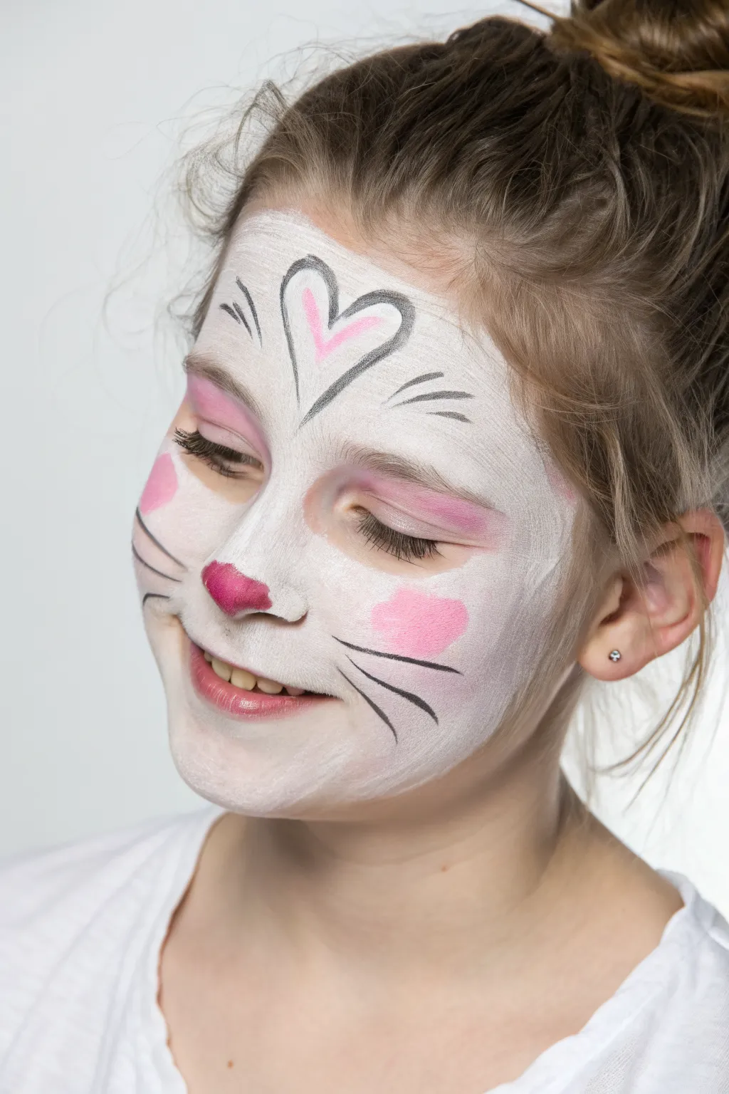 Cute bunny nose face paint idea with fluffy cheeks and soft pink blush, minimalist and sweet