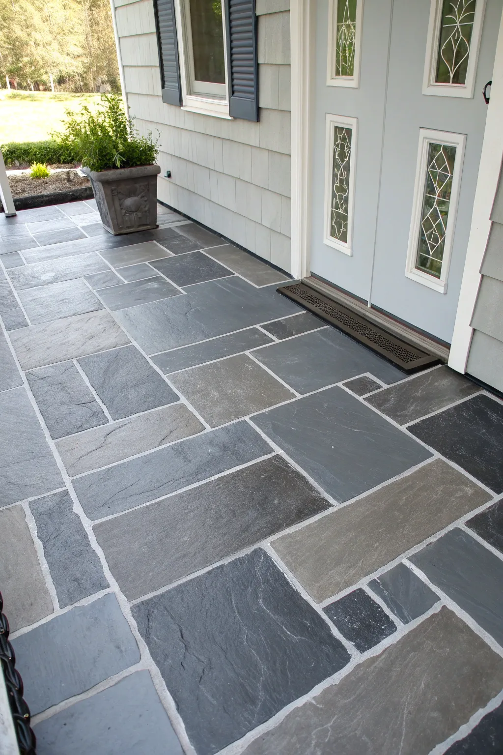 Faux slate block porch paint with soft grout lines and a modern black planter accent