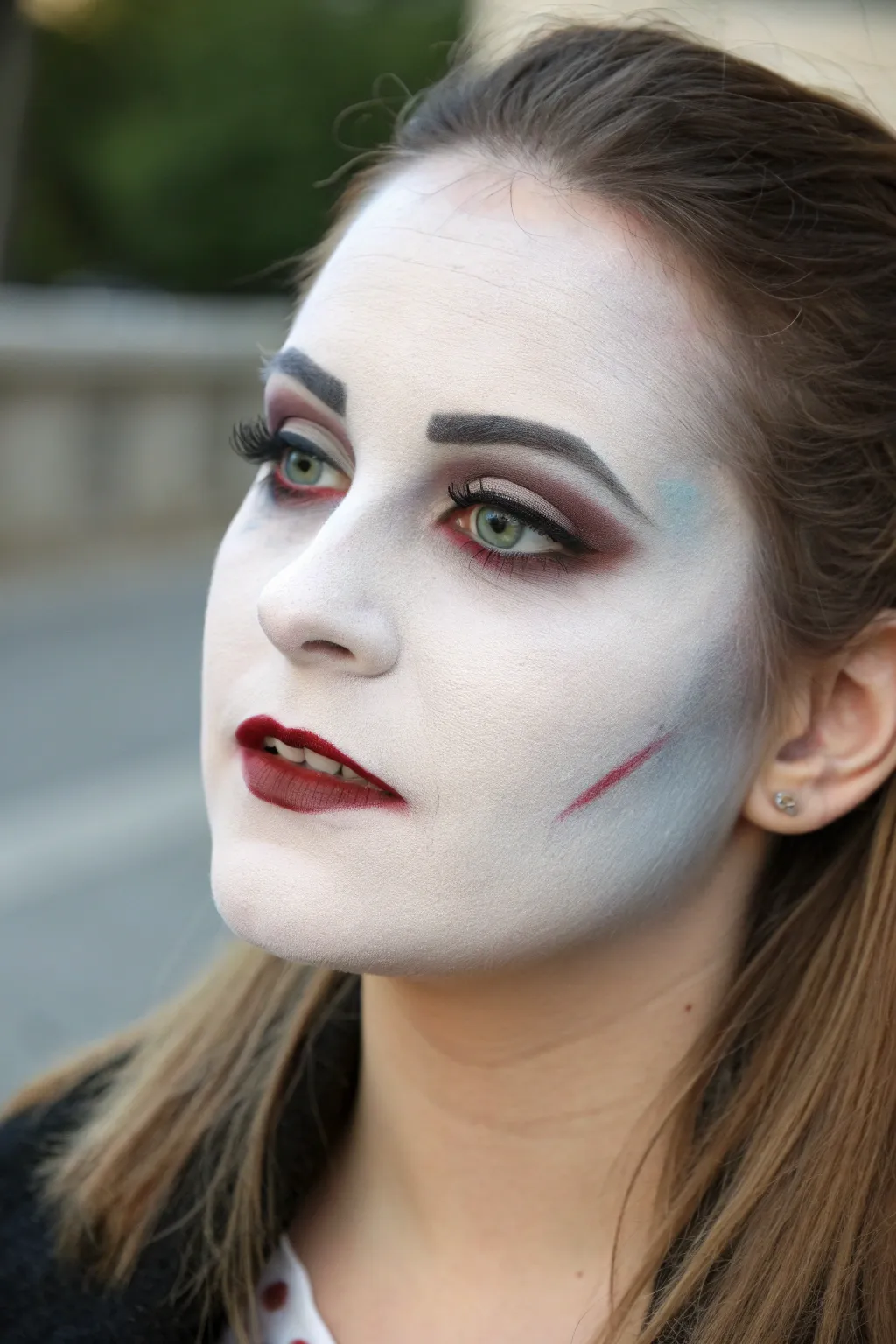 Vampire pallor face paint with crisp lips and subtle bite mark, minimalist Nordic mood