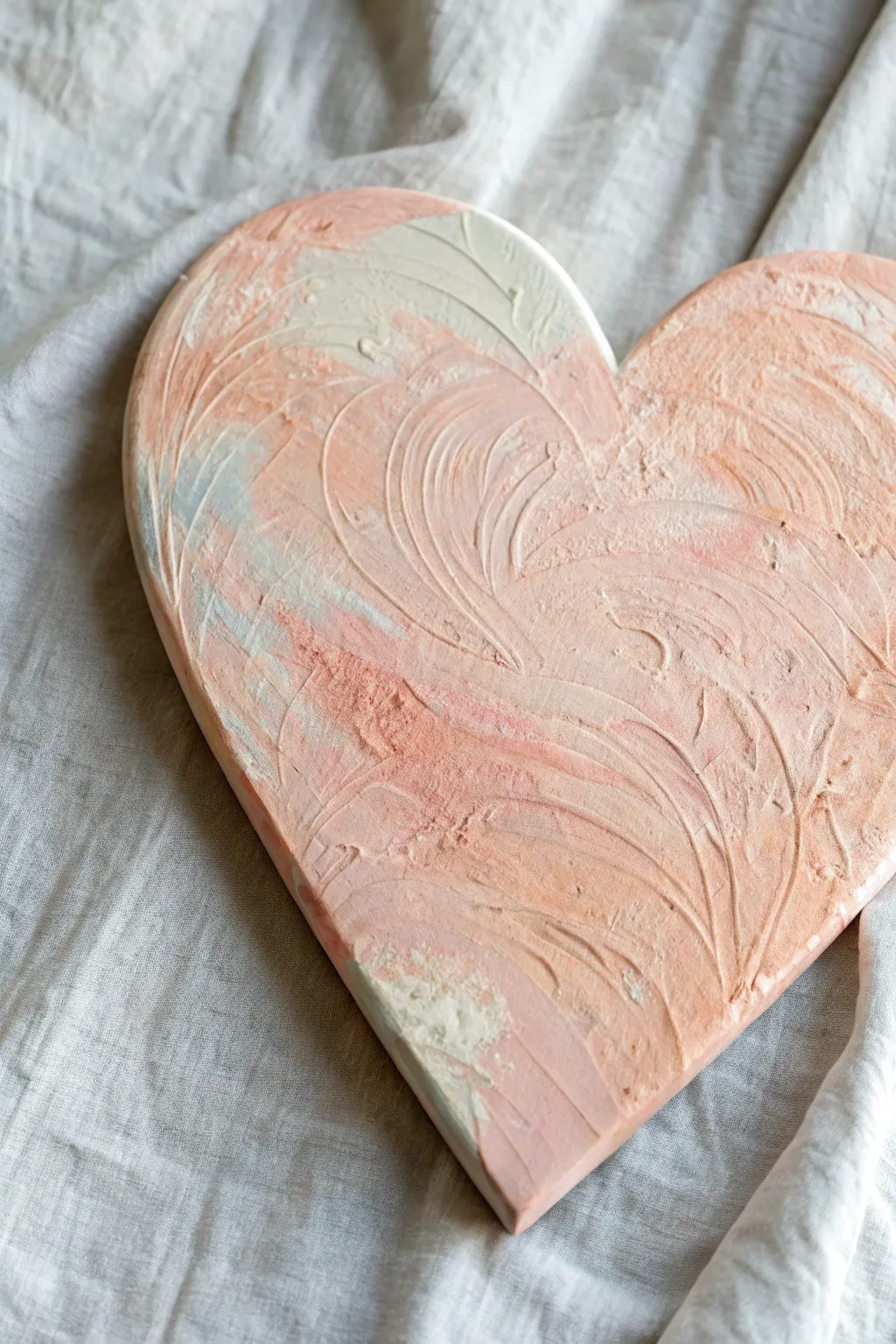 Easy finger-painted heart canvas with soft blended swirls, perfect for a cozy minimalist home craft.