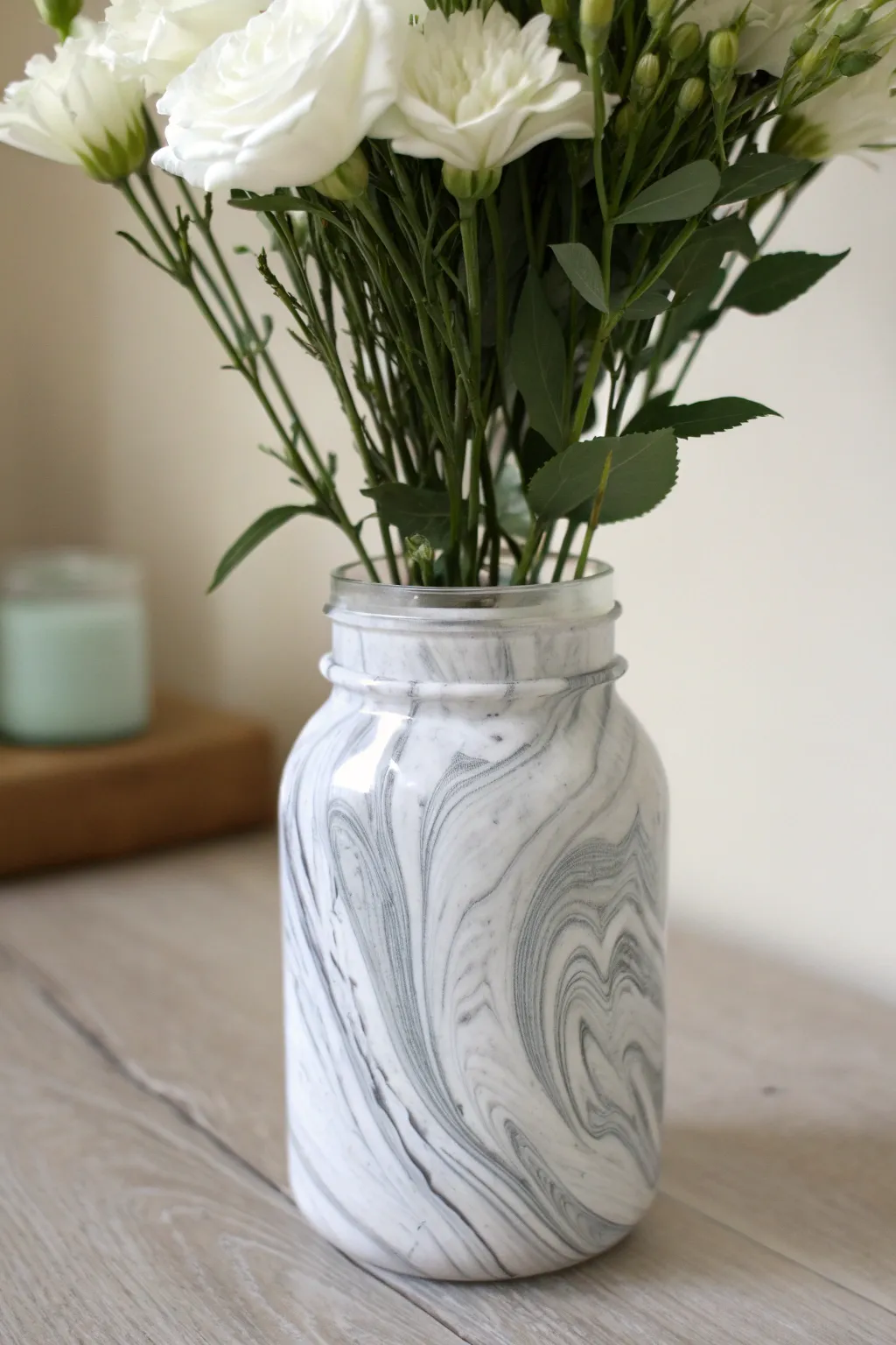 Marble-swirled mason jar vase: minimalist gray veining with airy stems for a chic boho-scandi centerpiece