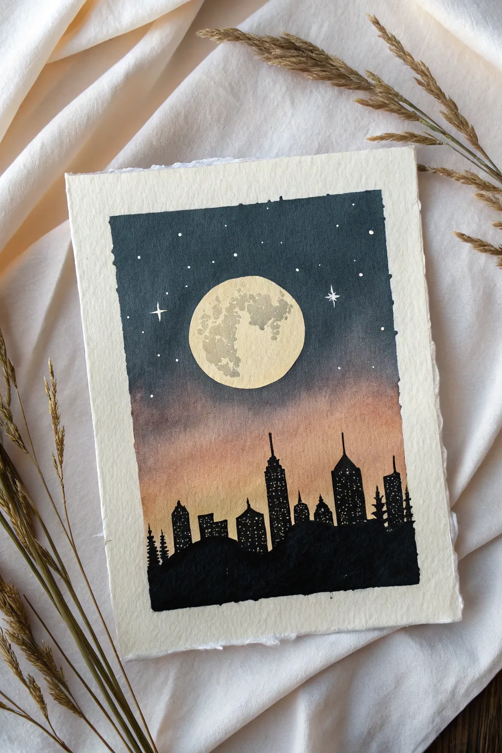 Minimal moonrise painting: bold full moon glow behind a simple black skyline silhouette