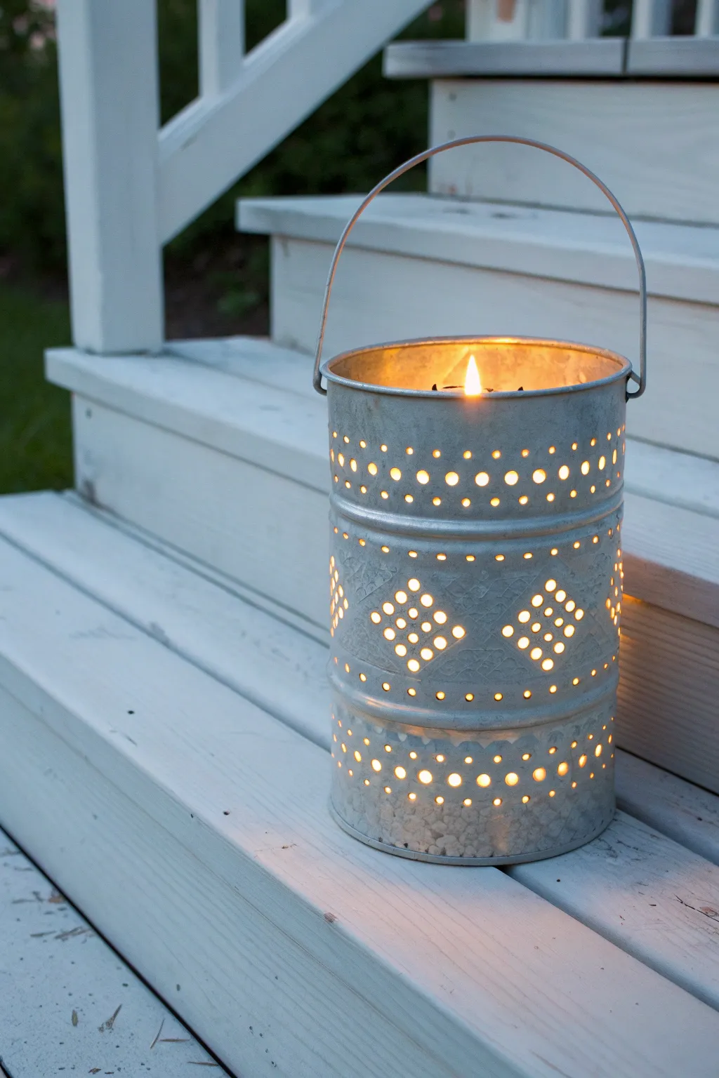 Turn a simple paint can into a glowing rustic lantern with cozy boho-scandi charm at dusk.