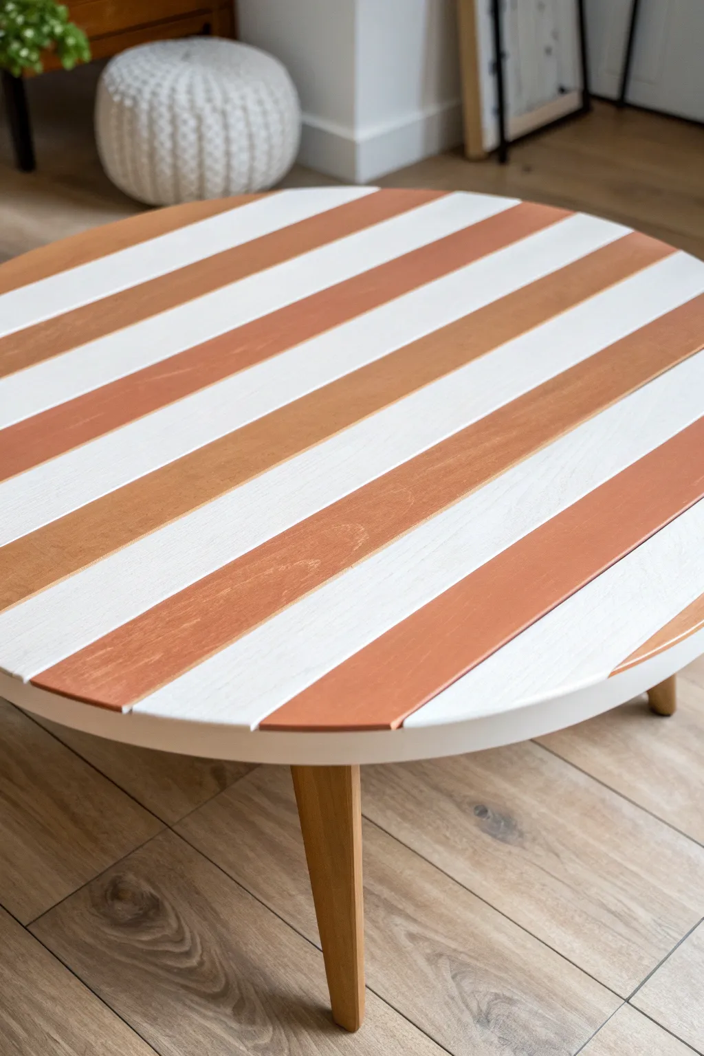Crisp tape-perfect stripes turn a simple coffee table into a modern Scandinavian statement.