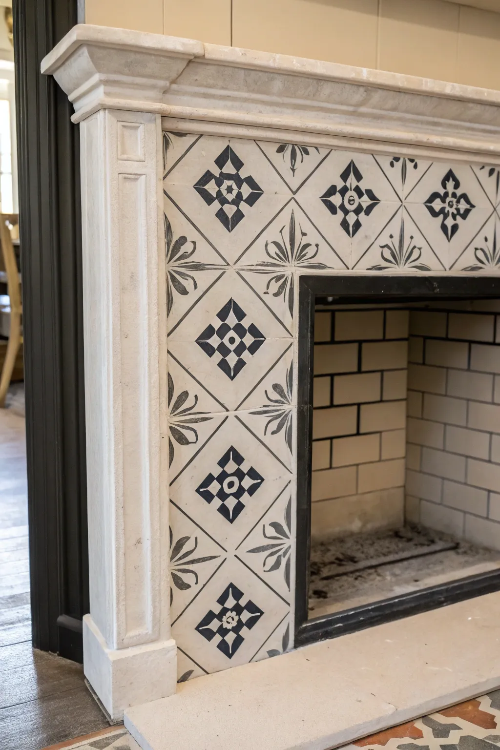 Crisp geometric stencil on a fireplace tile with stencil corner peeled back for faux cement charm