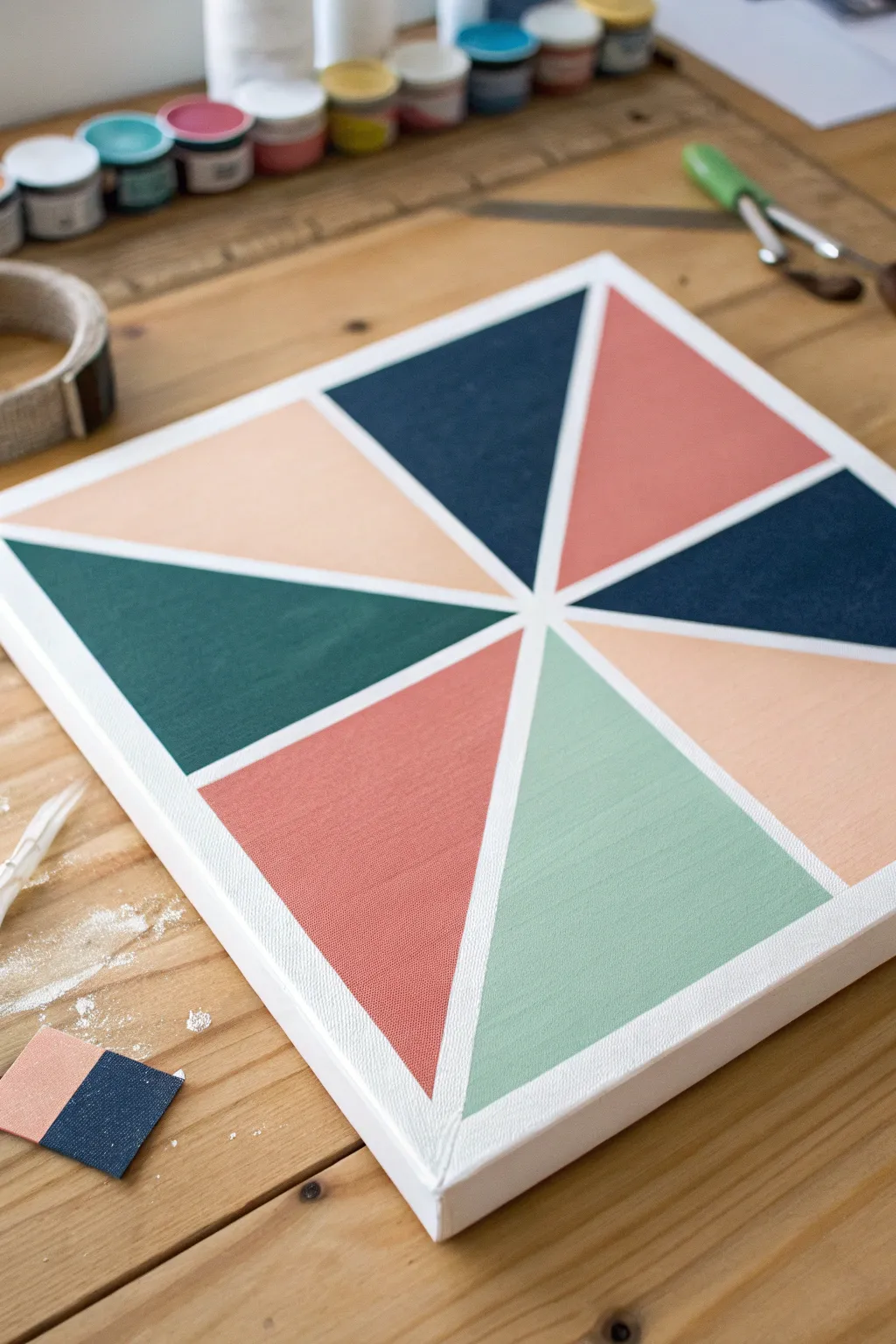 Crisp tape-resist triangles and stripes with bold color blocks and clean white reveals