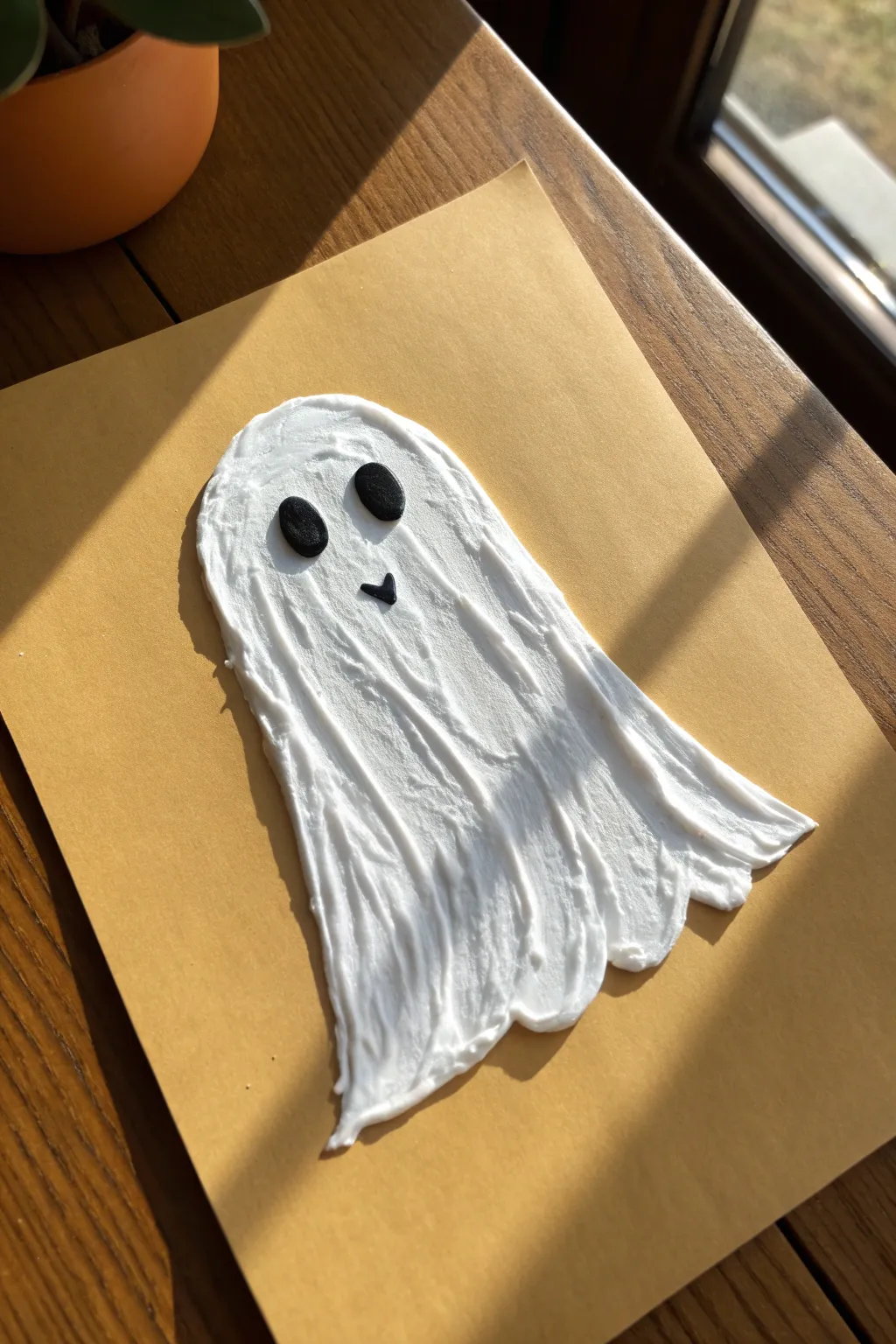 Minimalist puffy paint ghost with bold shadow and raised texture, perfect for spooky craft art