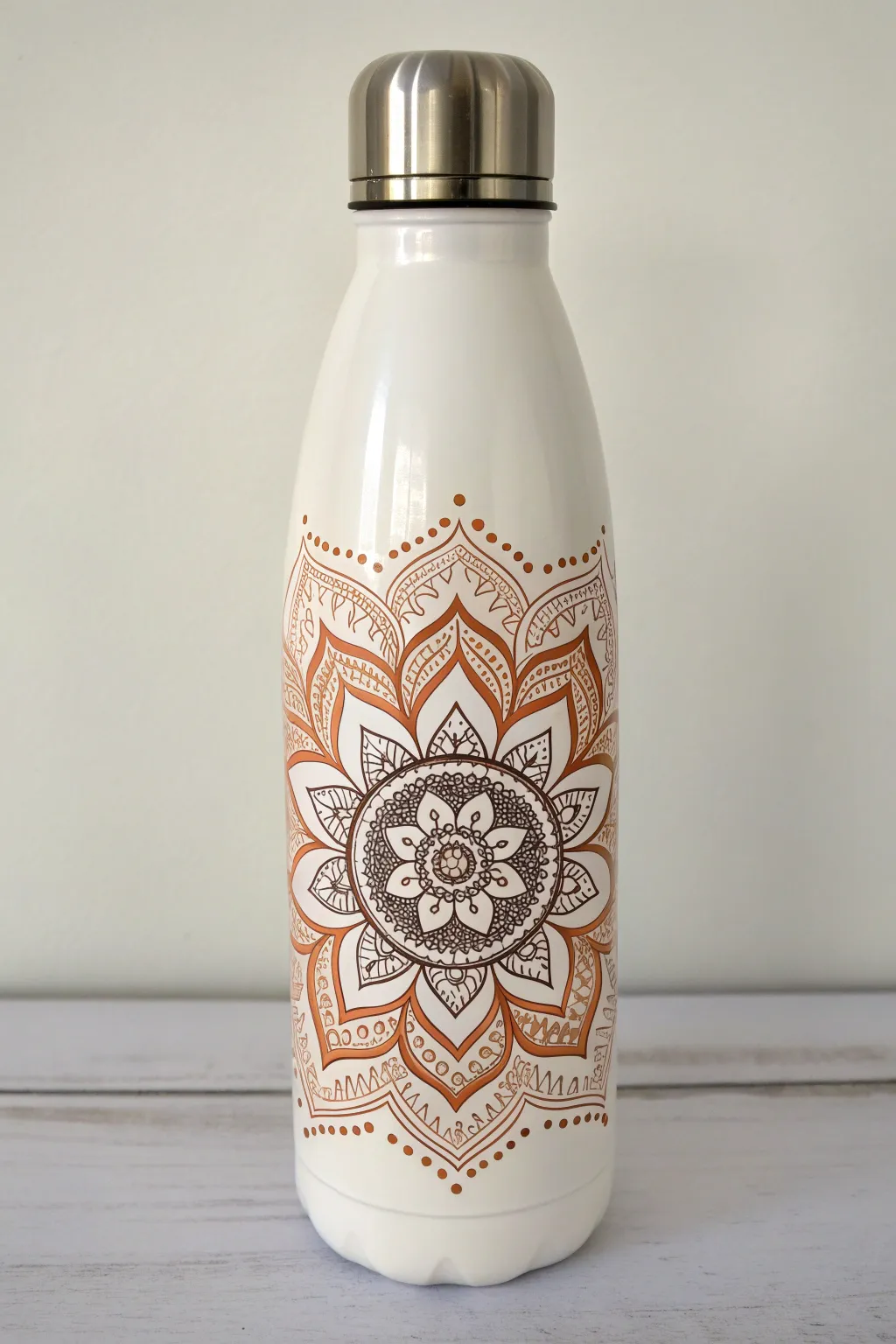 Minimal water bottle with a centered dotwork mandala wrap, crisp details and soft boho tones