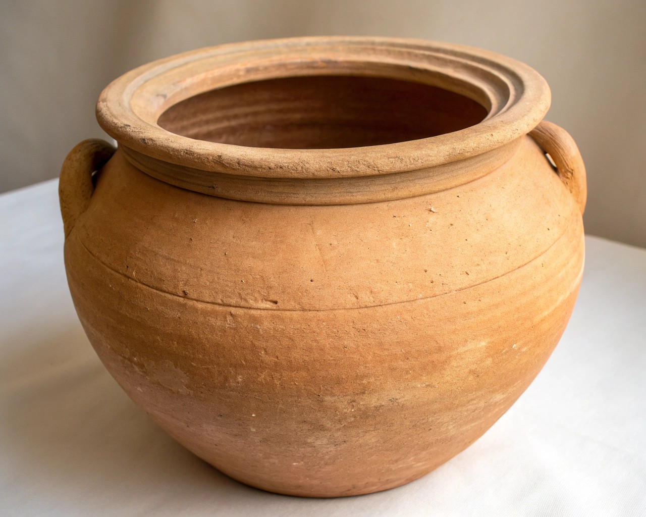 The natural porous texture of terracotta clay, highlighting its unique surface.